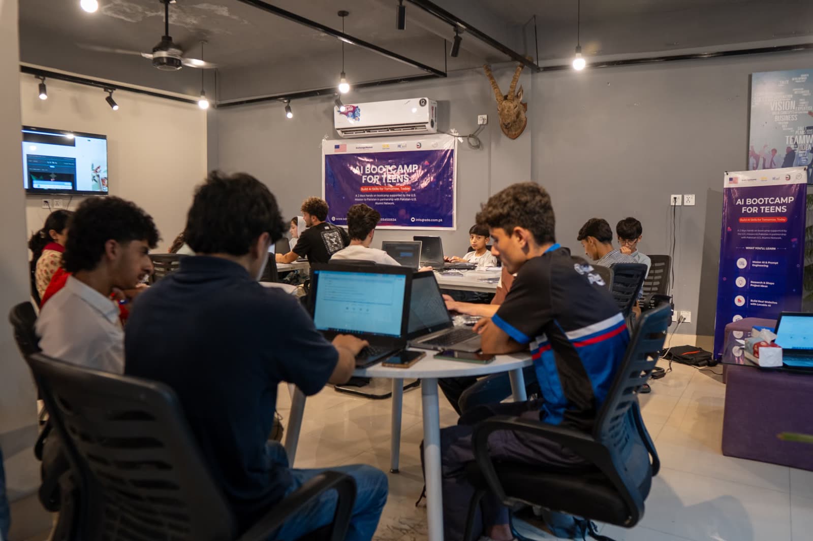Cohort 2 participants building projects on laptops at SDA Technology Hub